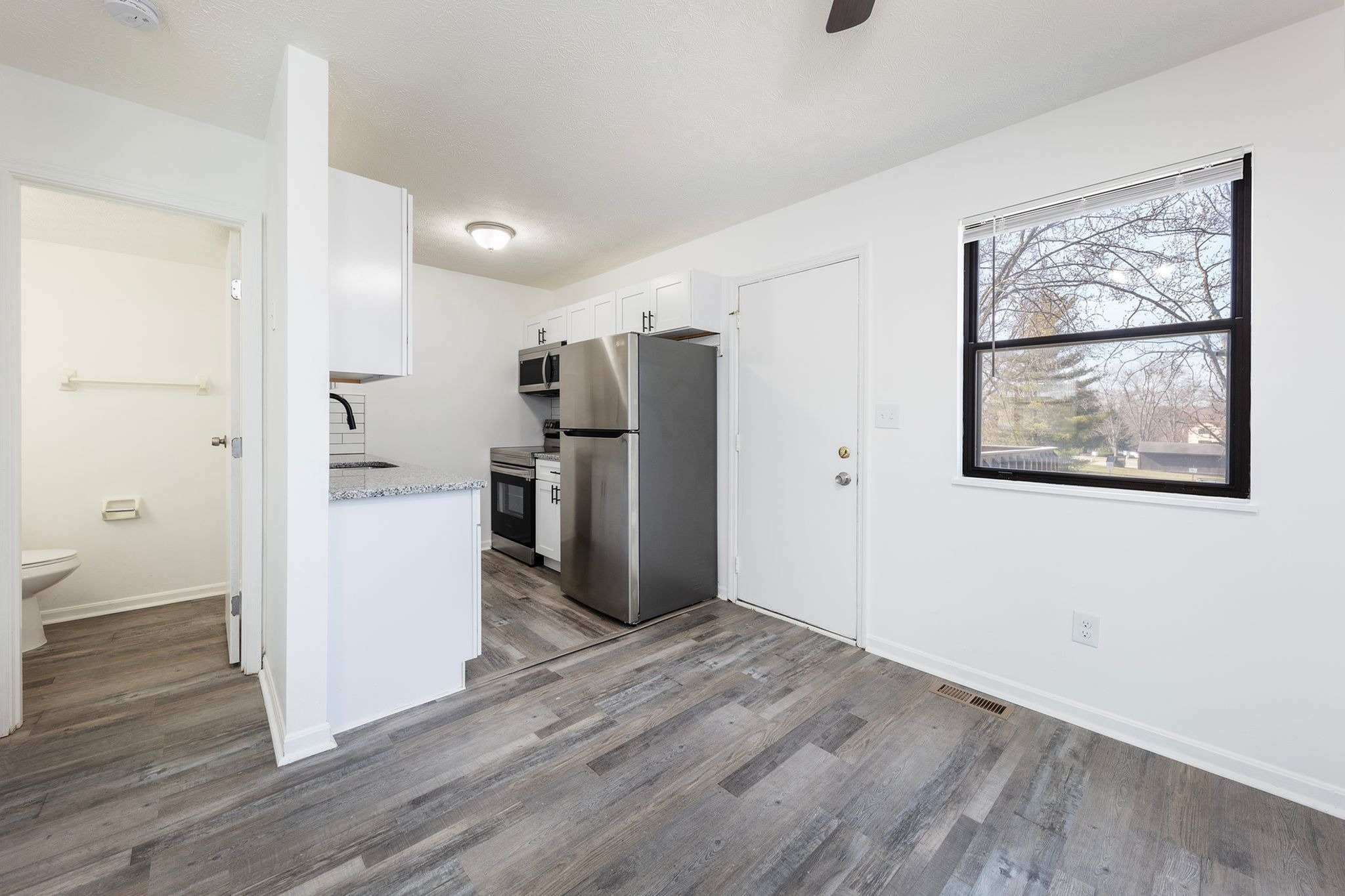 Renovated kitchen and dining area at Fairfield Square Apartments in Fairfield, Ohio